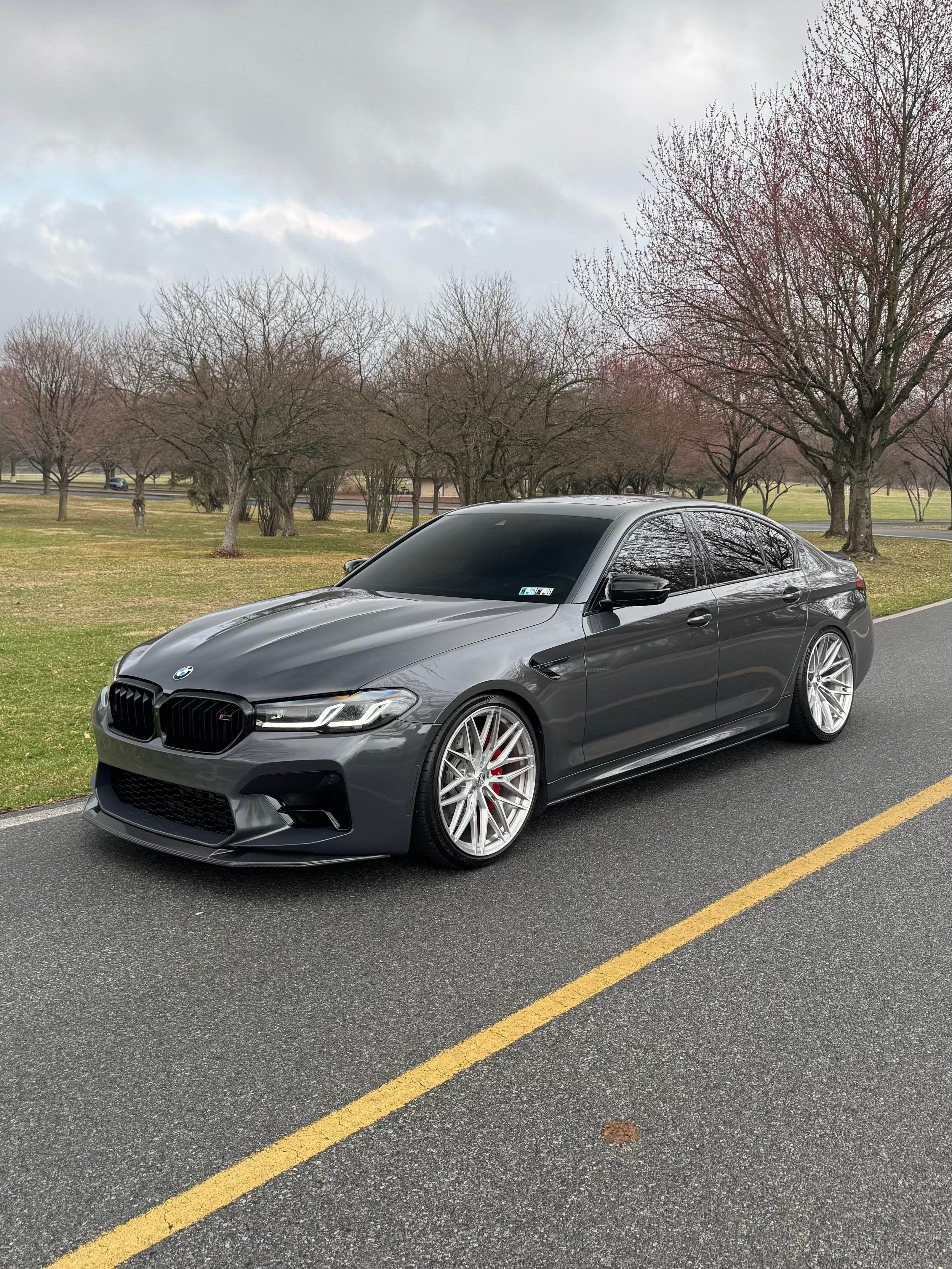 F90 BMW M5 LCI with Motivo Forged MB-F custom wheels in gloss brushed clear finish front side view